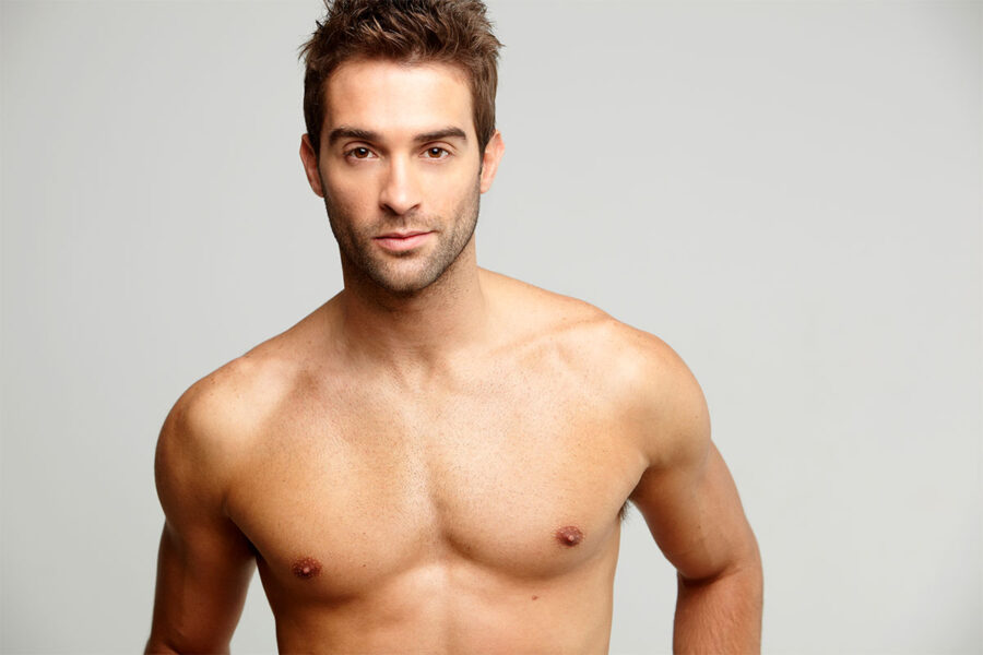handsome shirtless man after male breast reduction in Atlanta, GA
