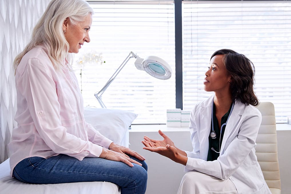 patient having a consultation with a board-certified plastic surgeon