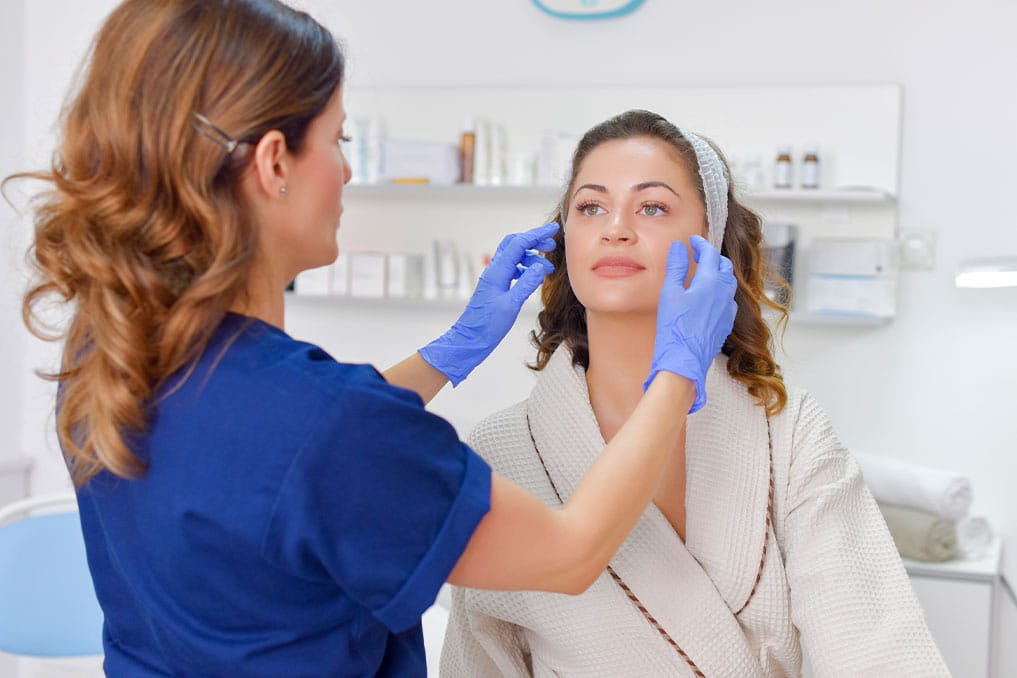 a board-certified plastic surgeon having a consultation with a patient