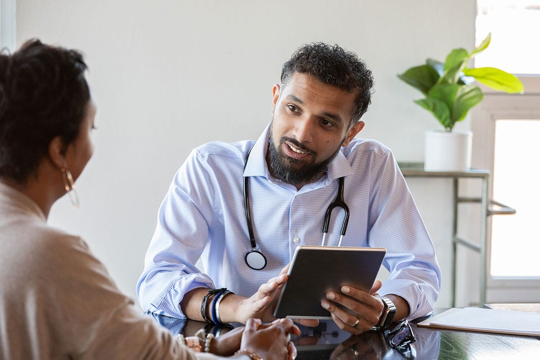 doctor in Marietta discussing financing options for plastic surgery with his patient