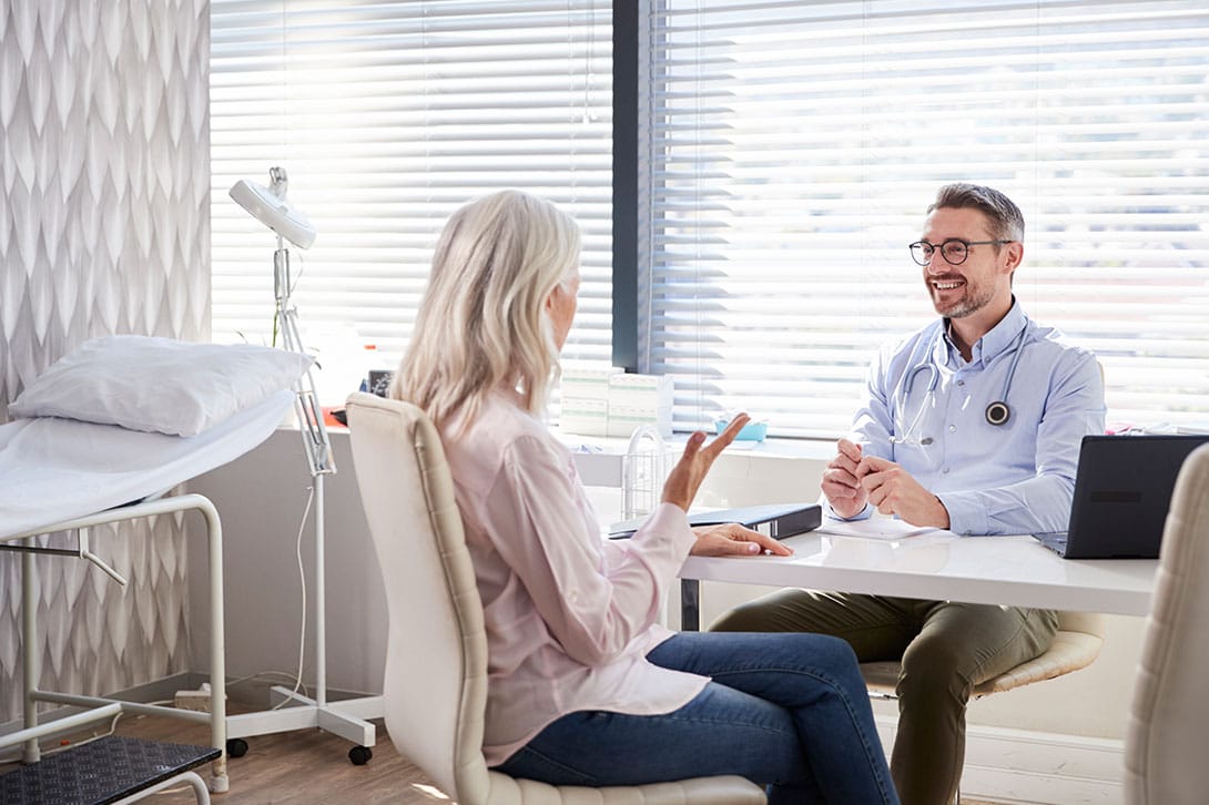 doctor and patient discussing finding the right plastic surgery location in Marietta