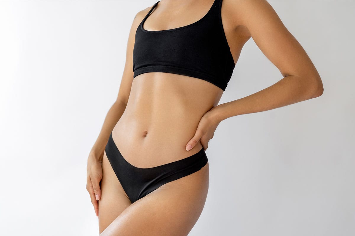 woman after getting a tummy tuck in Atlanta, GA